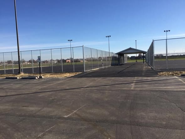 Chain-link fencing and gates at a community sports complex