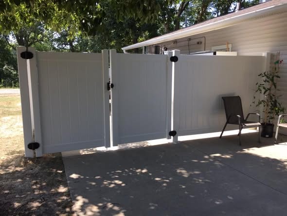 White vinyl double drive gate with matching walk gate