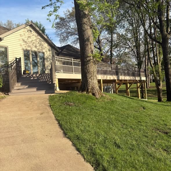 New deck and railing overlooking a lake